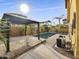 Inviting backyard oasis featuring a refreshing pool, pavered patio, and gazebo at 4319 E Vaughn Ave, Gilbert, AZ 85234
