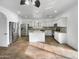 Modern kitchen with island, stainless steel appliances, and granite countertops at 4319 E Vaughn Ave, Gilbert, AZ 85234