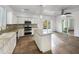 Spacious kitchen with granite island, stainless steel appliances, and access to backyard at 4319 E Vaughn Ave, Gilbert, AZ 85234
