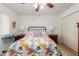 Spacious bedroom with a queen bed, dresser and ceiling fan at 439 N 56Th St, Mesa, AZ 85205