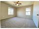 Spacious bedroom with neutral carpet and windows at 4565 E Loma Vista St, Gilbert, AZ 85295