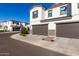 Two-story home with a two-car garage and a side view of the property at 4810 E Helena Dr, Scottsdale, AZ 85254