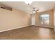 Bright living room with tile floors and ceiling fan at 5191 W Shannon St, Chandler, AZ 85226