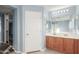 Main bathroom with double vanity and wood cabinets at 5240 W St Kateri Dr, Laveen, AZ 85339