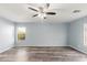 Bright bedroom with wood-look floors and ceiling fan at 5240 W St Kateri Dr, Laveen, AZ 85339