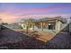 Spacious backyard with covered patio and gravel landscaping at 555 W Racine Loop, Casa Grande, AZ 85122