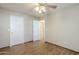 Well-lit bedroom, featuring tile floors and ceiling fan at 555 W Racine Loop, Casa Grande, AZ 85122
