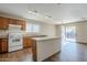 Kitchen with granite countertops, wooden cabinets, and an island at 555 W Racine Loop, Casa Grande, AZ 85122