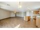 Open living room with tile floors and lots of natural light at 555 W Racine Loop, Casa Grande, AZ 85122