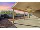 Covered patio and backyard with ceiling fans at 555 W Racine Loop, Casa Grande, AZ 85122