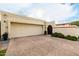 View of the two car garage and driveway at 629 E Myrtle Ave, Phoenix, AZ 85020