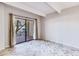 Bright living room featuring tile floors and sliding glass door leading to a patio at 7350 N Pima Rd # 162, Scottsdale, AZ 85258