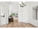 Bright dining area, hardwood floors and view into the living room at 8218 W Stella Ave, Glendale, AZ 85303