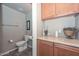 Small bathroom with toilet and storage at 8680 W Quail Track Dr, Peoria, AZ 85383