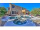 Inviting kidney-shaped pool with spa and ample patio space at 8680 W Quail Track Dr, Peoria, AZ 85383