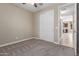 Bedroom with carpet and access to kitchen at 9415 W Colter St, Glendale, AZ 85305