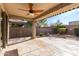 Spacious covered patio with ceiling fan and flagstone at 9415 W Colter St, Glendale, AZ 85305