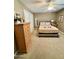 Bedroom with carpeted floors and a dresser at 10102 W Caron Dr, Sun City, AZ 85351