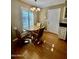 Bright dining area with wood floors and sliding glass doors at 10102 W Caron Dr, Sun City, AZ 85351