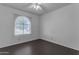 Spacious bedroom with an arched window and ceiling fan at 1049 S Mara Dr, Apache Junction, AZ 85120