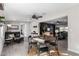 Modern dining area with a round table and four chairs, open to the living room at 10801 W El Dorado Dr, Sun City, AZ 85351