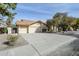 Single-story home with a two-car garage and landscaped front yard at 140 E Dawn Dr, Tempe, AZ 85284