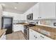 Well-equipped kitchen featuring stainless steel appliances and granite counters at 15119 W Montecito Ave, Goodyear, AZ 85395