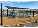 Community playground with shaded play area at 16068 W Prickly Pear Trl, Surprise, AZ 85387