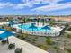 Community pool and playground with surrounding homes and landscaping at 16072 W Prickly Pear Trl, Surprise, AZ 85387