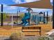 Community playground with slides, swings, and shade structures at 16081 W Desert Spoon Dr, Surprise, AZ 85387