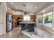 Bright kitchen with island, stainless steel appliances, and wood cabinets at 17101 E Malta Dr, Fountain Hills, AZ 85268