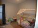 bedroom with bed, toys, and closet at 17134 N Eureka Trl, Surprise, AZ 85374