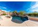 Inviting kidney-shaped pool with waterfall feature at 17939 W Lavender Ln, Goodyear, AZ 85338