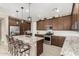 Modern kitchen with granite countertops and stainless steel appliances at 24589 N 172Nd Dr, Surprise, AZ 85387