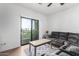 Living room with patio access and gray sectional sofa at 2511 W Queen Creek Rd # 340, Chandler, AZ 85248