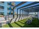 Two hanging chairs under a modern pergola in a community setting at 3131 N Central Ave # 6014, Phoenix, AZ 85012