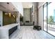 Modern community room features high ceilings, a fireplace, and ample seating at 3131 N Central Ave # 6014, Phoenix, AZ 85012