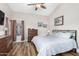 Main bedroom with king bed, dresser, and hardwood floors at 4042 S Shady Ct, Gilbert, AZ 85297