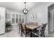 Bright dining area features a wood table and four chairs at 4042 S Shady Ct, Gilbert, AZ 85297