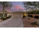 House exterior at dusk with two car garage at 4042 S Shady Ct, Gilbert, AZ 85297