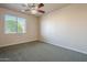 Bright bedroom with ceiling fan and window at 4202 E Broadway Rd # 132, Mesa, AZ 85206