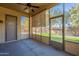 Screened-in back porch with ceiling fan and views of backyard at 43366 W Venture Rd, Maricopa, AZ 85138