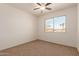 Spacious bedroom with ceiling fan and window at 600 S Dobson Rd # 75, Mesa, AZ 85202