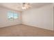 Spacious bedroom with ceiling fan and large window at 600 S Dobson Rd # 75, Mesa, AZ 85202