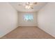 Spacious bedroom with ceiling fan and large window at 600 S Dobson Rd # 75, Mesa, AZ 85202