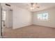 Bright bedroom with ceiling fan and bathroom access at 600 S Dobson Rd # 75, Mesa, AZ 85202