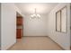 Simple dining room with tiled floors and a chandelier at 600 S Dobson Rd # 75, Mesa, AZ 85202
