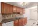 Kitchen with wood cabinets, granite countertops, and stainless steel appliances at 600 S Dobson Rd # 75, Mesa, AZ 85202