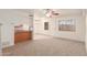 Spacious living room with carpeted floors and a ceiling fan at 600 S Dobson Rd # 75, Mesa, AZ 85202