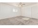 Bright bedroom with carpet flooring, ceiling fan and double door closet at 6110 E Ensenada St, Mesa, AZ 85205